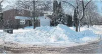  ?? JACK LAKEY ?? A wall of snow may seem like an outrage, but not to people who live north of the city, where a long, snowy winter is no big deal.