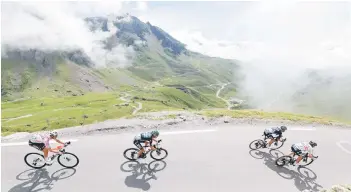  ??  ?? The pack descends the Tourmalet pass during the 18th stage of the 108th edition of the Tour de France cycling race, 129 km between Pau and Luz Ardiden. — AFP file photo