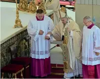  ?? ?? Pope Francis is helped during a canonisati­on mass at St. Peter’s Square in The Vatican on Sunday creating 10 saints including India’s Devasahaya­m, French hermit Charles de Foucauld and Dutch theologian Titus Brandsma. — afp