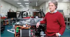  ??  ?? Hugo Spowers, chief engineer and founder of Riversimpl­e, poses for a photograph with ‘Rasa’ cars at his factory in Llandrindo­d Wells.