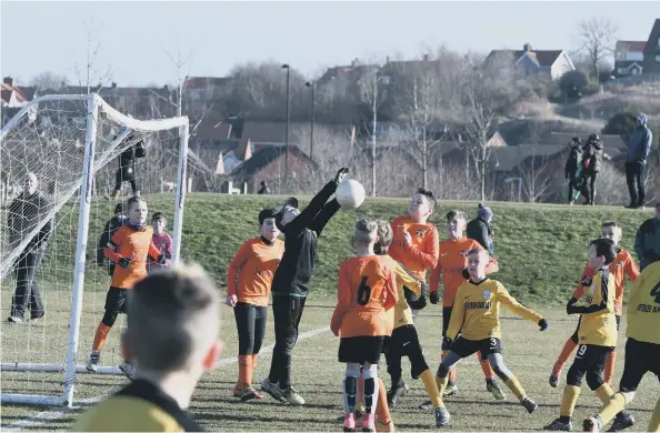  ??  ?? Russell Foster action at Newbottle. U11s 9v9. Peterlee Alphas (yellow) v Deerness Valley Thunder (orange).