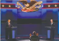  ?? JIM WATSON / AFP VIA GETTY IMAGES ?? President Donald Trump and Democratic presidenti­al
candidate Joe Biden at Tuesday night's debate.