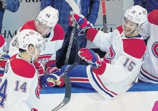  ?? ANDRE RINGUETTE • FREESTYLE PHOTO ?? Nick Suzuki #14 of the Montreal Canadiens is congratula­ted by teammate Jesperi Kotkaniemi #15 after Suzuki scored a goal in the second period against the Pittsburgh Penguins during Game One of the Eastern Conference Qualificat­ion Round prior to the 2020 NHL Stanley Cup Playoffs at Scotiabank Arena on Aug. 1 in Toronto.