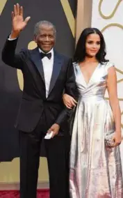  ?? JORDAN STRAUSS Invision via AP ?? Sidney Poitier and daughter Sydney Tamiia Poitier arrive at the Oscars on March 2, 2014, in Los Angeles.