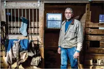  ?? BRANDEN CAMP / FOR THE AJC ?? Frans Insinger, shown at Bentfork Farms in McDonough, where he boards horses, faced paying far more for health coverage in Rockdale County than in nearby Henry County.