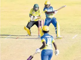  ?? CWI MEDIA PHOTO ?? Barbados opener Aaliyah Alleyne plays a shot on her way to an unbeaten half-century against Jamaica Women in their third round T20 Blaze clash at Warner Park in St. Kitts yesterday. Wicketkeep­er Natasha McLean looks on.