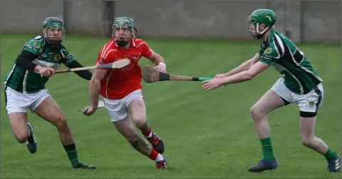  ??  ?? Eddie Power goes for a gap in the Erin’s Isle defence during Saturday’s semi-final success in O’Toole Park, Crumlin.