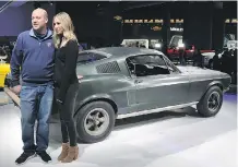  ??  ?? Sean Kiernan, the owner of the 1968 Ford Mustang from the film Bullitt, with Molly McQueen, granddaugh­ter of Steve McQueen, the film’s star.