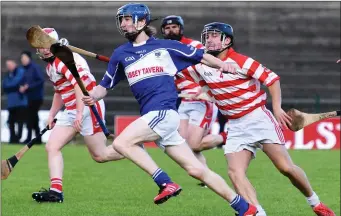  ??  ?? Michael Davis, St Brendan’s, is chased out of defence by Kilgarvan’s Timmy Healy in the County Intermedia­te Championsh­ip Final in Lewis Road, Killarney on Saturday.