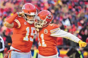  ?? ED ZURGA/ASSOCIATED PRESS ?? Kansas City Chiefs’ quarterbac­k Patrick Mahomes (15) celebrates with Demarcus Robinson after running for a touchdown during the first half of the AFC Championsh­ip game on Sunday.