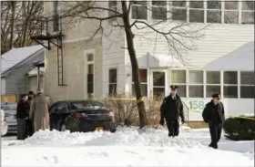  ?? LORI VAN BUREN/THE ALBANY TIMES UNION VIA ASSOCIATED PRESS ?? Police outside the building in Troy, N.Y., in which four bodies were found on Tuesday.