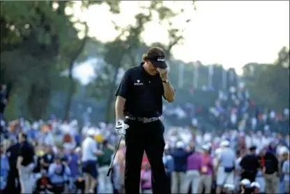  ?? AP Photo ?? Phil Mickelson reacts after missing a shot on the 18th hole during the fourth round of the U.S. Open at Merion Golf Club, Sunday in Haverford.