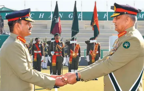  ?? ISPR ?? General Qamar Javed Bajwa (right) hands over command of the Pakistan Army to General Asim Munir (left) at a ceremony in Rawalpindi. Munir becomes the 17th army chief — taking over one of the most powerful posts in the country.