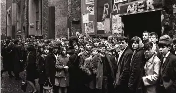  ??  ?? That was then: Youngsters line up outside the Cavern club back in the 1960s