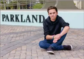 ?? ASSOCIATED PRESS ?? DAVID HOGG, A SENIOR AT MARJORY STONEMAN DOUGLAS High School, poses for a photo at Pine Trails Park on Tuesday in Parkland, Fla. Hogg, one of the leaders of the March For Our Lives movement, is spearheadi­ng the national effort to register young voters...