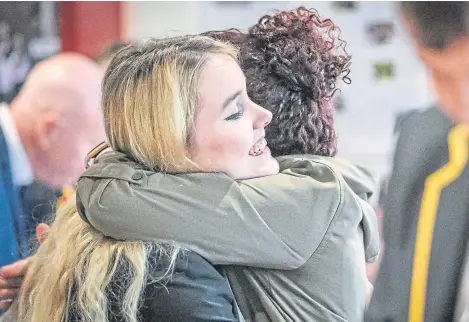  ??  ?? Taylor Williams of Kirkcaldy High celebrates after achieving the grades she needs for St Andrews University.