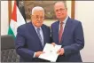  ?? REUTERS ?? Mahmoud Abbas (left) appoints Mohammad Mustafa as prime minister of the Palestinia­n Authority on Thursday.