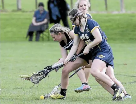  ??  ?? Hillcrest High School’s Giorgia Parsonson challengin­g for the ball against Avondale College.