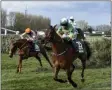  ?? PETER POWELL - THE ASSOCIATED PRESS ?? Rachael Blackmore ridding Minella Times clears the last fence to win the Randox Grand National Handicap Chase on the third day of the Grand National Horse Racing meeting at Aintree racecourse, near Liverpool, England, Saturday April 10, 2021.