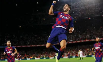  ??  ?? Luis Suárez leaps in celebratio­n after opening the scoring. Photograph: Albert Gea/Reuters