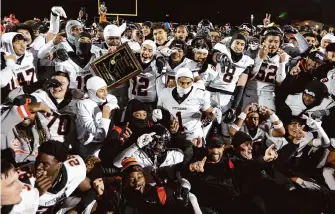  ?? Dennis Lee/SBLive Sports ?? Pittsburg players celebrate after beating San Ramon Valley-Danville 37-21 for the Pirates’ third straight North Coast Section Division 1 championsh­ip and sixth overall.