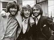  ?? SYDNEY O’MEARA/GETTY IMAGES/TNS ?? Popular English vocal trio the BeeGees; fromleft to right, brothers Barry, Robin andMaurice Gibb (1949 - 2003).