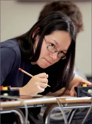  ?? Arkansas Democrat-gazette/ryan MCGEENEY ?? Cortni Dick of Huntsville prepares Wednesday for Quiz Bowl, an academic event in which the Huntsville High School team will compete in March 10 at Greenwood. Dick is one of two students on the Huntsville team who has been accepted to attend the...