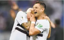  ?? Hector Vivas / Getty Images ?? Chicharito (right) and Miguel Layun of Mexico embrace in the aftermath of their side’s 2-1 victory over South Korea.