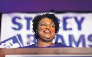  ?? JOHN BAZEMORE/ ASSOCIATED PRESS ?? Democratic candidate for Georgia governor Stacey Abrams smiles as she speaks during an election-night watch party on Tuesday in Atlanta, Ga.