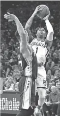  ?? CHRIS SZAGOLA/AP ?? Nets guard D’Angelo Russell shoots and draws the sixth foul on 76ers guard JJ Redick on Saturday in Philadelph­ia.