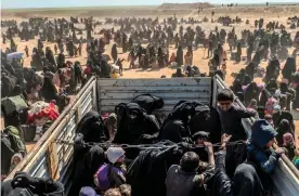  ??  ?? Women and children evacuated from Baghouz arrive at a screening area, in March last year Photograph: Bülent Kılıç/AFP via Getty Images