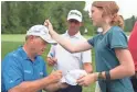  ?? KYLE TERADA/USA TODAY SPORTS ?? Craig Hocknull (left) exchanges autographs with spectator Megan Holder.