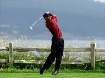  ?? AP Photo/Elise Amendola ?? In this 2000 file photo, Tiger Woods tees off on the 18th hole on his way to winning the 100th U.S. Open Golf Championsh­ip at the Pebble Beach Golf Links in Pebble Beach, Calif.
TULSA TIME