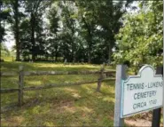  ?? DAN SOKIL— DIGITAL FIRST MEDIA ?? A sign indicates the entrance to the Tennis-Lukens Cemetery off of Allentown Road in Towamencin.