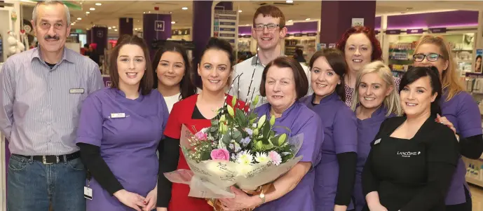  ??  ?? Anne Devine who is retiring from Hickey’s Pharmacy pictured with staff at the West Street Branch.