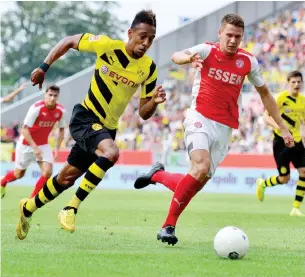  ??  ?? Pierre-Emerick Aubameyang (left) in action for Borussia Dortmund