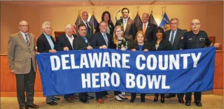  ??  ?? Delaware County Council joined Criminal Investigat­ion Division Detective Robert Lythgoe, president of the Hero Scholarshi­p Fund, in recognizin­g the dedicated volunteers, coaches and sponsors who make the Hero Bowl a success during the April 25 Council...