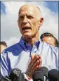  ?? LANNIS WATERS / THE PALM BEACH POST ?? Gov. Rick Scott speaks Thursday outside Marjory Stoneman Douglas High School in Parkland.