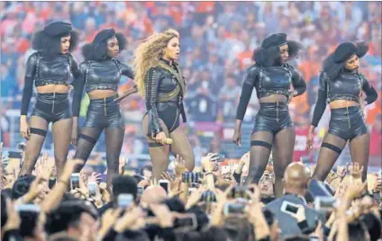  ?? Photo: USA Today Sports/Reuters ?? Prowling: Beyoncé and her Black Panthers during the Super Bowl performanc­e.