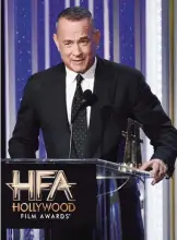  ??  ?? Tom Hanks accepts the Hollywood actor award.