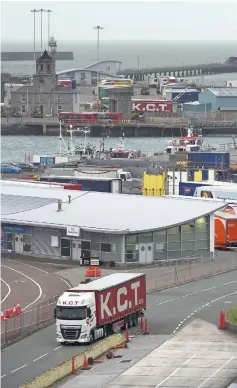  ??  ?? A Dutch truck passes through security at the port in Holyhead, Anglesey in north-west Wales. – AFP photo