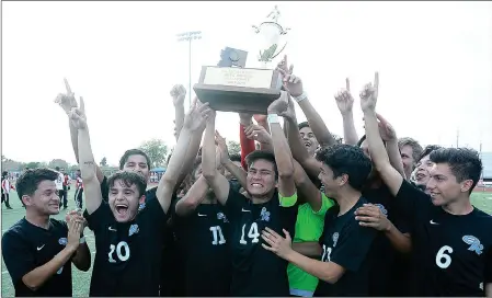  ?? Buy these photos at YumaSun.com PHOTO BY RANDY HOEFT/YUMA SUN ?? Gila Ridge soccer players hoist the state championsh­ip trophy following their 3-0 win over Phoenix-Cortez in Saturday afternoon’s Arizona Interschol­astic Associatio­n 4A Division Boys Soccer State Championsh­ip game at Williams Field High School in Gilbert.