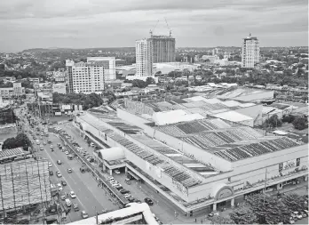  ?? MACKY LIM ?? EXPENSIVE. With J.P. Laurel being the central commercial and business district of Davao City, it is said to have the most expensive high real estate properties in Mindanao today. Seen in this file photo are some of the major commercial and residentia­l...