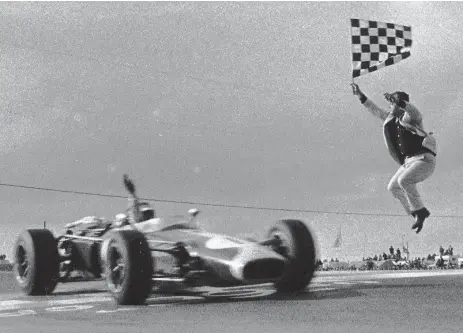  ?? BORIS SPREMO/TORONTO STAR FILE PHOTO ?? Jim Clark winning the 1966 U.S. Grand Prix at Watkins Glen, N.Y. The win signalled the end of the dominance of front-engined, roadster-style race cars.