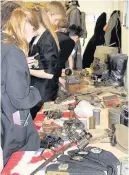  ??  ?? War memories McLaren High pupils look at the WW1 memorabili­a