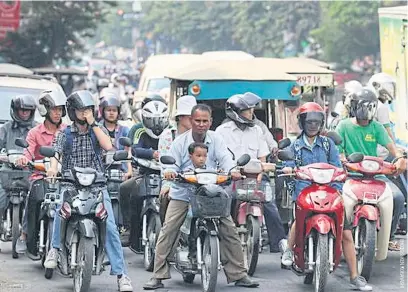  ??  ?? RIGHT Many of Phnom Penh’s drivers are uninsured or underinsur­ed, both for liability for accidents and hospital treatment should they have a mishap.