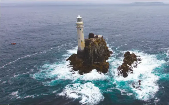  ??  ?? A classic yacht racing goal – rounding the Fastnet Rock