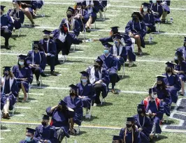  ?? MATIAS J. OCNER mocner@miamiheral­d.com ?? Florida Internatio­nal University students attend their graduation ceremony inside the Riccardo Silva Stadium in Miami on April 24, 2021.