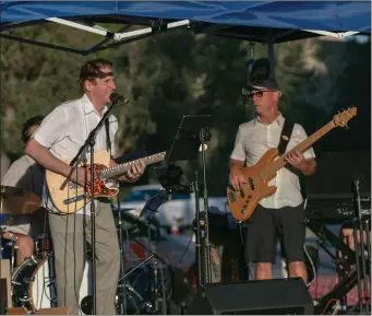  ?? Eddy Martinez/The Signal (See additional photos at signalscv.com) ?? (Left) Tony Galla and Mark LeVang play music on Friday afternoon. For the fourth straight week, the sounds of live jazz and blues bands filled Town Center Drive as Galla and LeVang jammed out at the Valencia Jazz & Blues Concert Series. The series will...