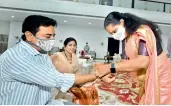  ??  ?? Former MP Kavitha, sister of IT and Industries Minister K.T. Rama Rao, ties rakhi to her brother.